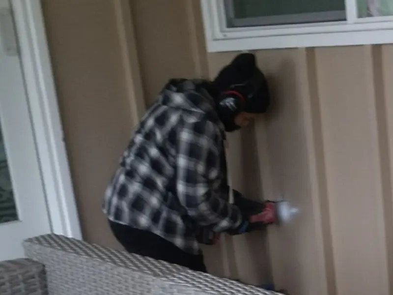Professional electrician installing an exterior outlet in Middletown
