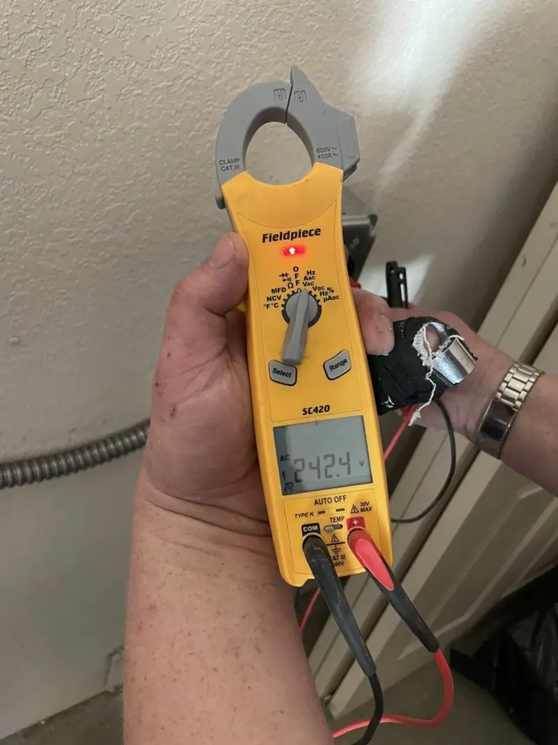 Voltage testing with clamp meter during Electrical Installation Services in Middletown